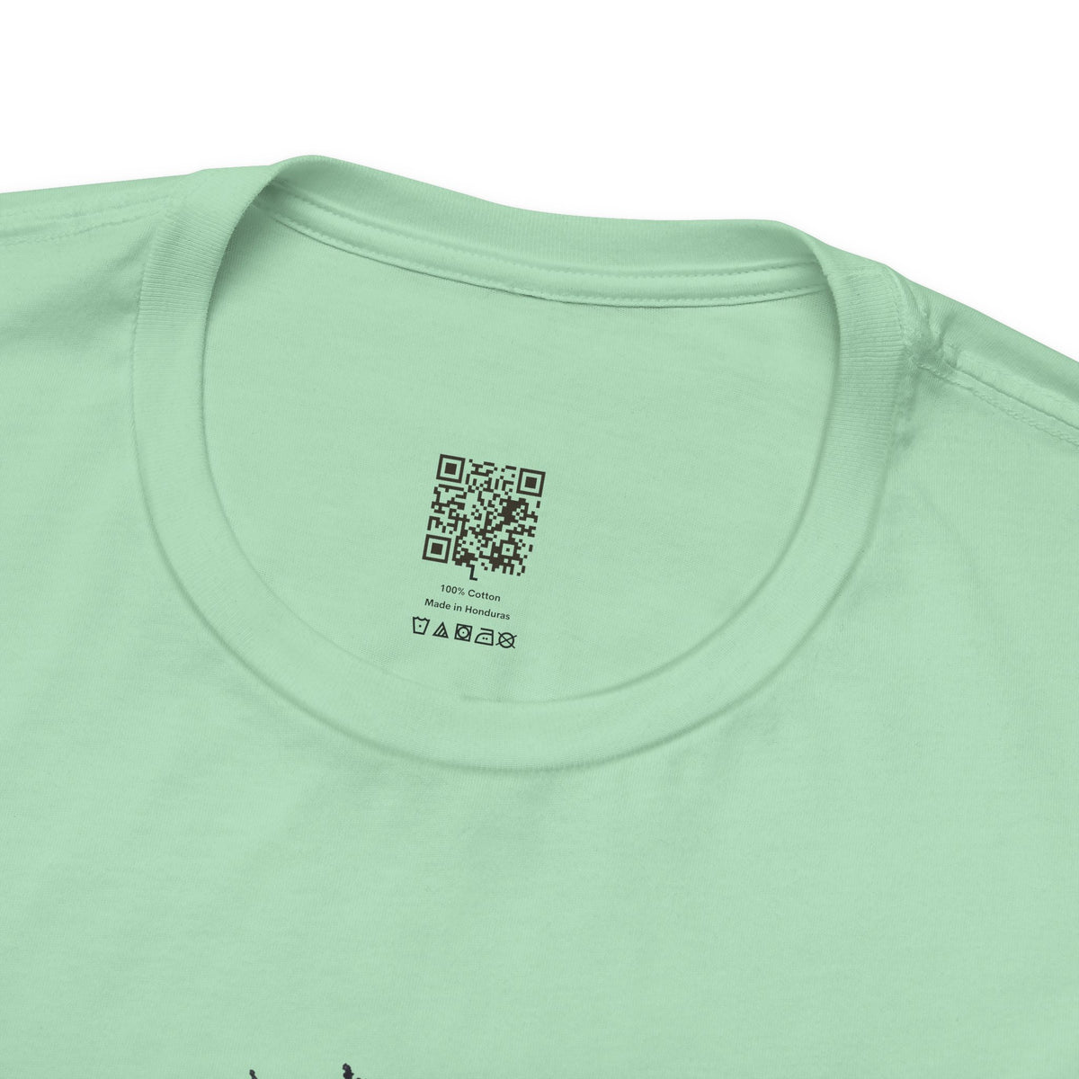 Dragon Eye graphic tee in mint, collar close-up: printed Organic Truth QR neck label