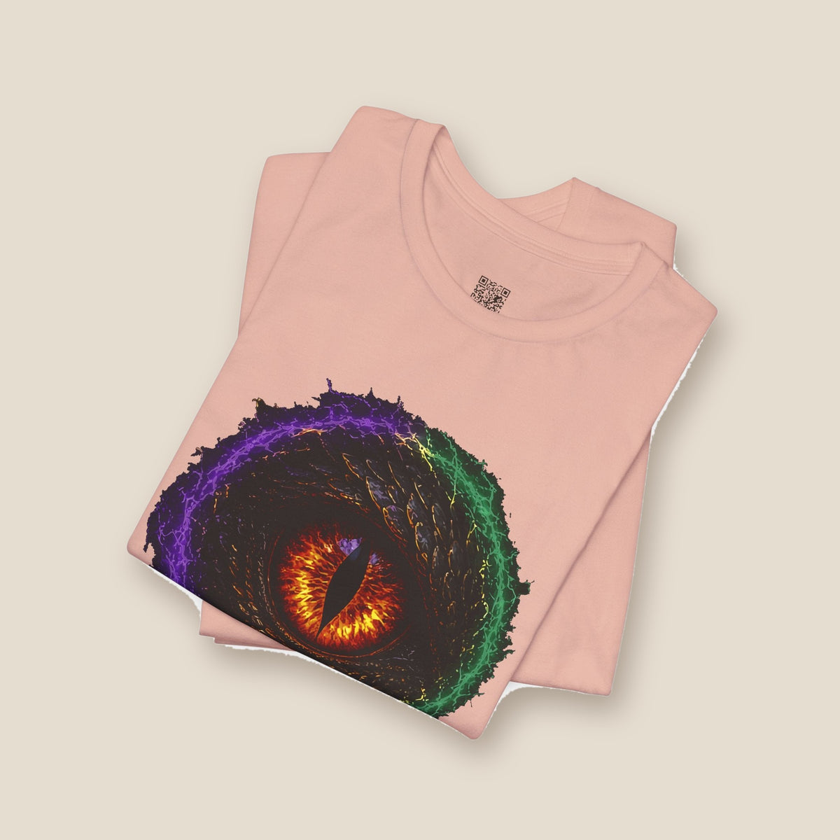Dragon Eye graphic tee in peach, folded: fire-lit dragon eye front