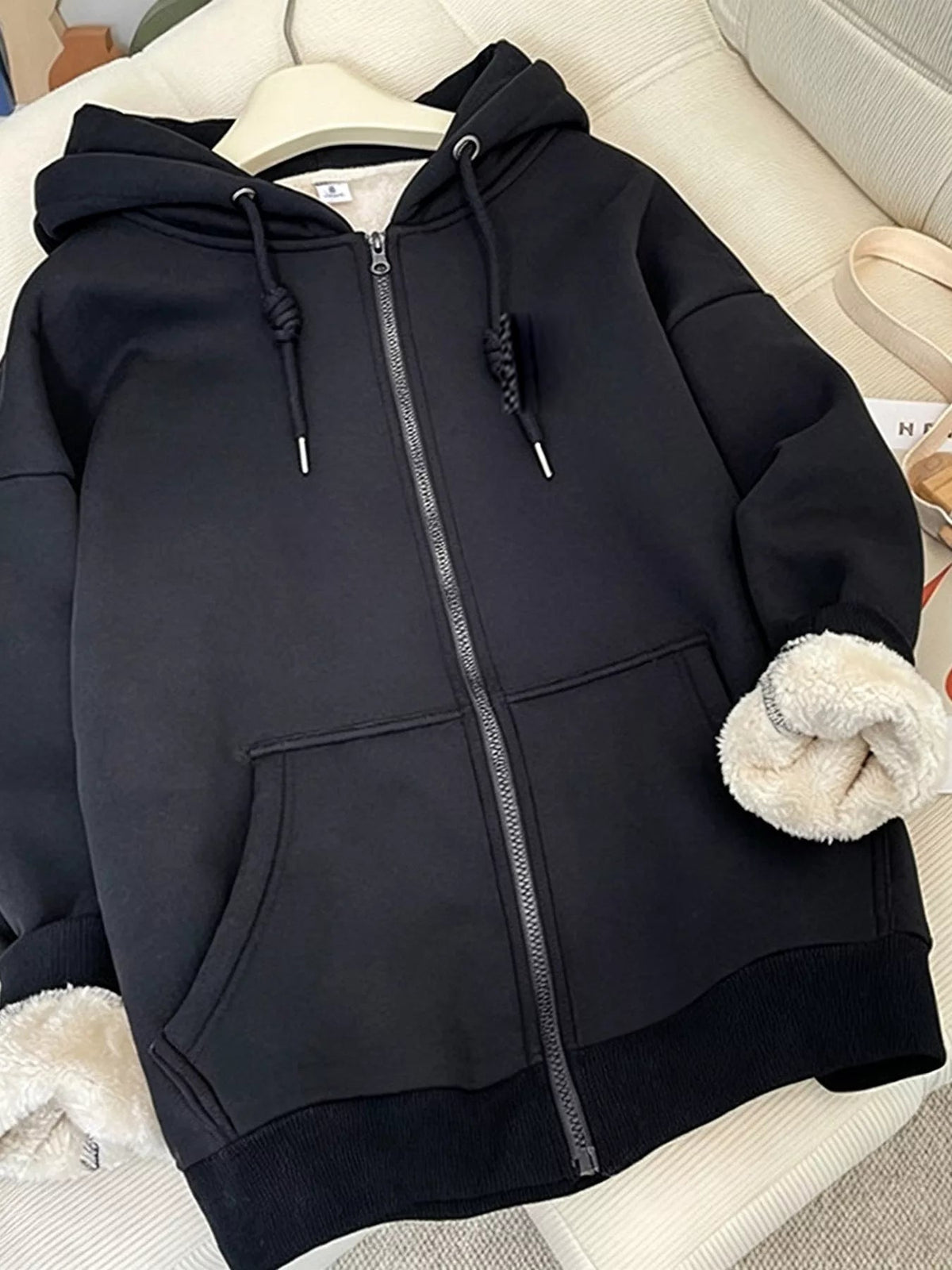 Black fleece-lined zip-up hoodie front — Organic Truth