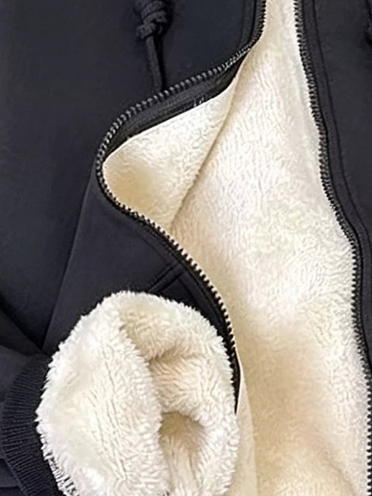 Black fleece-lined zip-up hoodie sherpa lining detail — Organic Truth