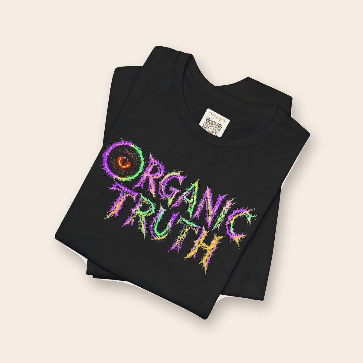 Lightning Eye cotton tee in black, folded, showing the neck label